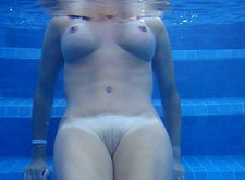 Older MILF nude in the pool 